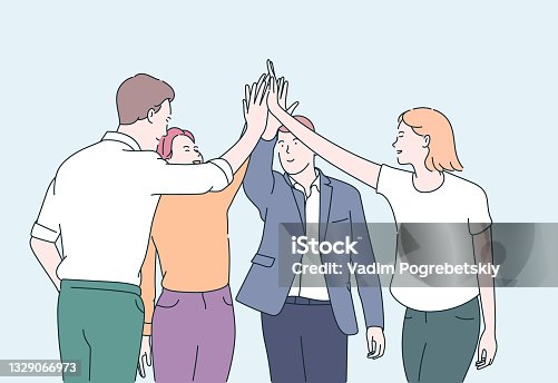 istock Teamwork and team building concept. Young business people office workers partners standing and giving hands after successful negotiations. 1329066973