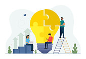 istock Teamwork concept with building lightbulb puzzle. Team metaphor. Business people teamwork. Flat vector illustration isolated on white background. 1315896673