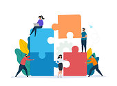 Teamwork concept with building puzzle. People working together with giant puzzle elements. Symbol of partnership and collaboration. Flat vector illustration isolated on white background.