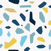 Terrazzo seamless pattern of large blue yellow fragments on white background.