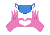 istock Thank you for wearing mask. Gloved hands making heart 1368016209