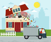 istock The concept of excessive consumerism. House bursting of stuff. Throwing away things from house. Junk removal. 1076930186