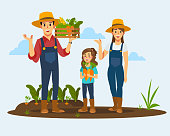 The farmer and his family collect vegetables in the vegetable garden.farmer concept.