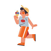 istock The funny young boy in orange shorts eating ice cream. Vector illustration in the flat cartoon style. 1221557343