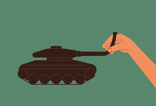 The giant twists the barrel of the tank by hand, no war, peace concept