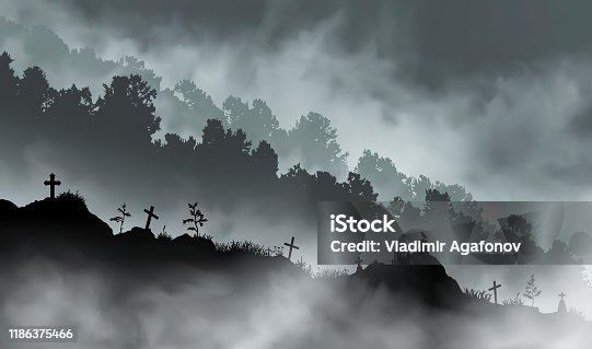 istock The old abandoned graveyard on the hill in front of the mountains covered with forest. 1186375466