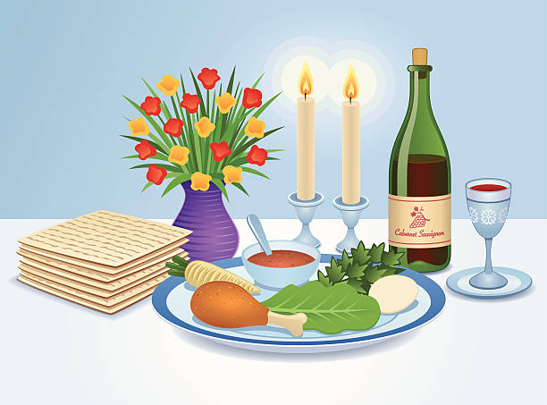 The traditional Jewish Passover Seder table, including the a tray with six symbolic dishes, Matzah bread, wine, a Kiddush cup and candles.  