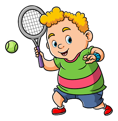 The sporty boy is hitting the tennis ball with the big racket