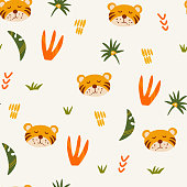 istock Tiger seamless pattern. Muzzle of a cute tiger cub with jungle plants. Tropical Animals. Children design for fabric, print, wrapper, textile. Vector flat illustration for kids 1388926895