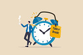 istock Time to take a break, coffee break time to relax and refresh from long stress interval, free from bored, sleepy and fatigue concept, relax businessman with a cup of coffee or tea with alarm clock. 1355248804