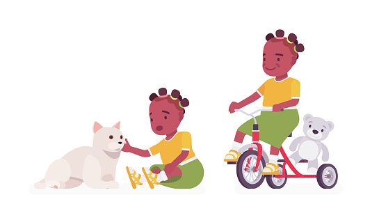 Toddler child, black little girl with cat pet, riding tricycle
