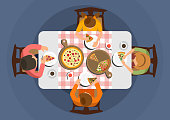 Top view. Cartoon people are sitting at table and eating pizza. Time for lunch. Family dines with Italian food. Vector illustration.
