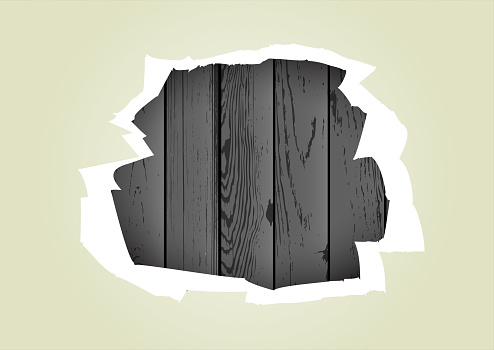 torn paper hole wood background