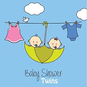 Twins baby shower. twin babies inside an umbrella