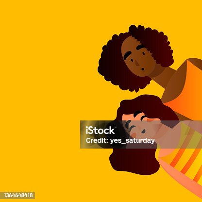 istock Two girls look out behind the wall 1364648418