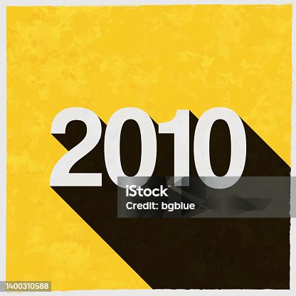 istock 2010 - Two thousand ten. Icon with long shadow on textured yellow background 1400310588
