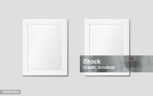 istock Two white frames on the wall. Vector modern mock up 1160963834