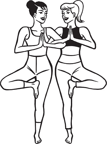 Two women practicing yoga