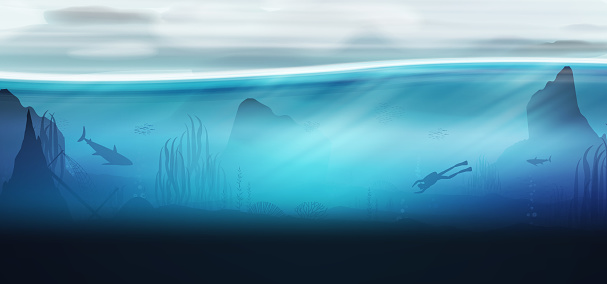 Underwater ocean scene background of reefs with scuba diver