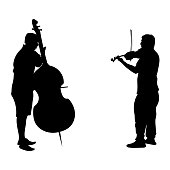 istock Vector black silhouettes people. Two adult men play musical instruments. The violinist is holding the violin, the guy is playing cello, side view people. Street musicians isolated on white background. 1294615187