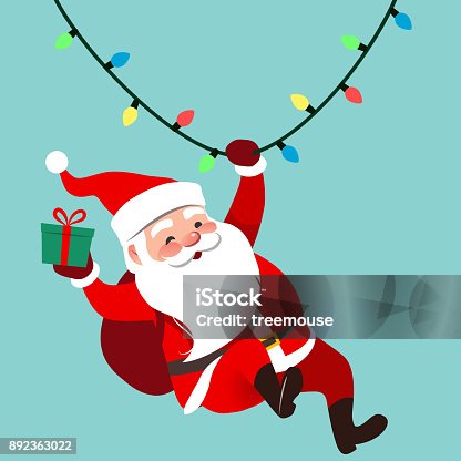 istock Vector cartoon illustration of cute traditional Santa Claus character swinging on a string of rope Chrismas lights, wrapped gift in hand, isolated on aqua blue. Christmas winter holiday design element 892363022