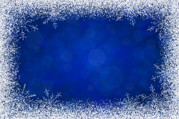 Christmas holidays white frame with snow and snowflakes on dark blue background. The eps file is organised into layers for the background, the bokeh, the frame and the snowflakes.