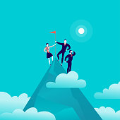 Vector flat illustration with business people standing on mountain peak top holding flag on blue clouded sky background. Victory, achievement, reaching aim, partnership, motivation, leader - metaphor.