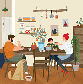 istock vector gouache painted flat illustration of a happy family at home in the kitchen for lunch, dinner or breakfast, mother, father, child and dog in a cozy apartment are sitting at the table and eating 1145654703