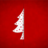A vector illustration of an ornate white christmas tree in the right of a red background. There are snow flakes, baubles and stars all over the white colored tree.  Apt for Xmas, Christmas, New Year Day New year's eve, holiday, vacation, vacations  theme backgrounds, greeting card, poster and backdrop. The tree is only partially visible, half of it being hidden, being slid into an opening or cut on the sheet, looks like an envelope.