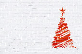 Red and white color brick pattern wall texture grunge background vector illustration. A scribbling of a hand drawn Christmas tree with one star at the top is  towards the right in the frame. Horizontal frame. Brick wall with rectangular blocks, textured grungy backgrounds. No text. No people, copy space, copyspace. The masonry joints joint are white in color.  Xmas, Christmas theme background, backgrounds, wallpaper, greeting card, gift wrapping paper.