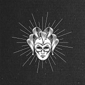 vector illustration of engraving venetian carnival mask or jester emblem and light rays on black cardboard texture. carnival symbol