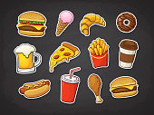 istock Vector illustration. Set of fast food. Pizza slice, burger, hot dog, cheeseburger, French fries, donut, Fried chicken leg, beer, ice cream, croissant, paper cup of soda, coffee. Stickers with contour 1067016678