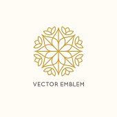 Vector logo design template and emblem made with leaves and flowers - luxury beauty spa concept - badge for yoga studios, holistic medicine centers, natural cosmetics and organic food products