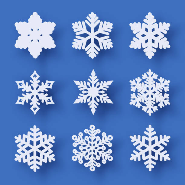 Vector set of 9 paper cut snowflakes with shadow Vector set of 9 white Christmas paper cut snowflakes with shadow on blue background. New year and Christmas design elements snowflake stock illustrations