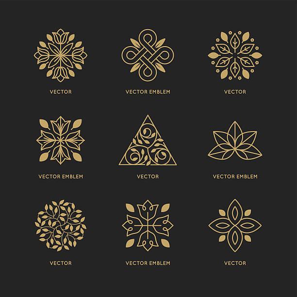 Vector set of logo design templates Vector set of logo design templates and emblems in trendy linear style in golden colors on black background - floral and natural cosmetics concepts and alternative medicine symbols flower symbols stock illustrations