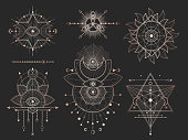 Vector set of Sacred geometric symbols and figures on black background. Gold abstract mystic signs collection drawn in lines. For you design: tattoo, print, posters, t shirts, textiles and magic craft