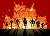A vector silhouette style illustration of a team of superheroes walking away from explosion. Wide space available for your copy.