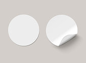 Vector white realistic round paper adhesive stickers with curved corner on transparent background.