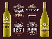 Vector vintage red and white wine labels and wine bottle mockups. Cabernet sauvignon, chardonnay, merlot, moscato, riesling and sauvignon blanc labels. Winemaking business branding and identity design elements.