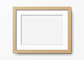 Horizontal wooden frame with passepartout hanging on a white wall. Blank elegant frame template. Picture frame vector mockup.