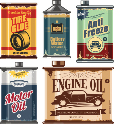 Vintage collection of old motor and engine oil cans, anti freeze, water and tire glue bottles.