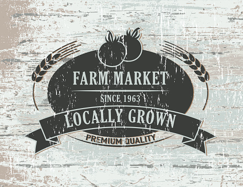 Vintage Faded Farm Sign On Wood Background.