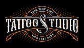 Vintage lettering of tattoo studio. icon template on dark background. Text is on the separate group.