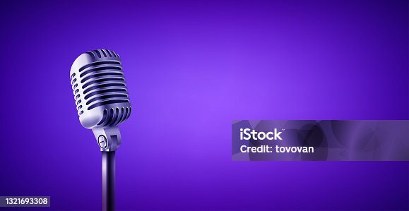 istock Vintage style microphone in studio. Vivid color banner with copy space 1321693308