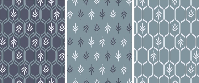 Vintage wallpaper with small leaves and regular honeycomb mesh. Seamless pattern. White elements on blue background.