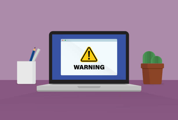 Warning sign on a laptop vector art illustration