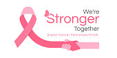 istock We are stronger together, Breast cancer awareness month text and pink ribbon with hand hold hand vector Design 1369291732
