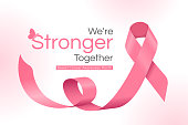 istock We are stronger together, Breast cancer awareness month text and pink ribbon rolling wave vector Design 1369518999