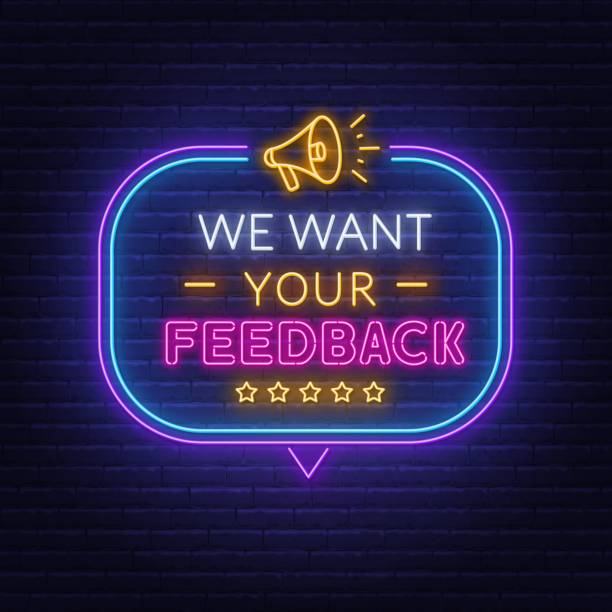 We want your feedback neon sign in speech bubble frame with megaphone. We want your feedback neon text in speech bubble frame with megaphone on brick wall background. desire stock illustrations