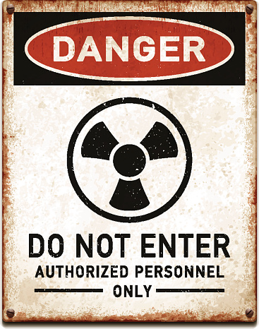 Weathered metallic placard with danger radioactive trefoil symbol_vector